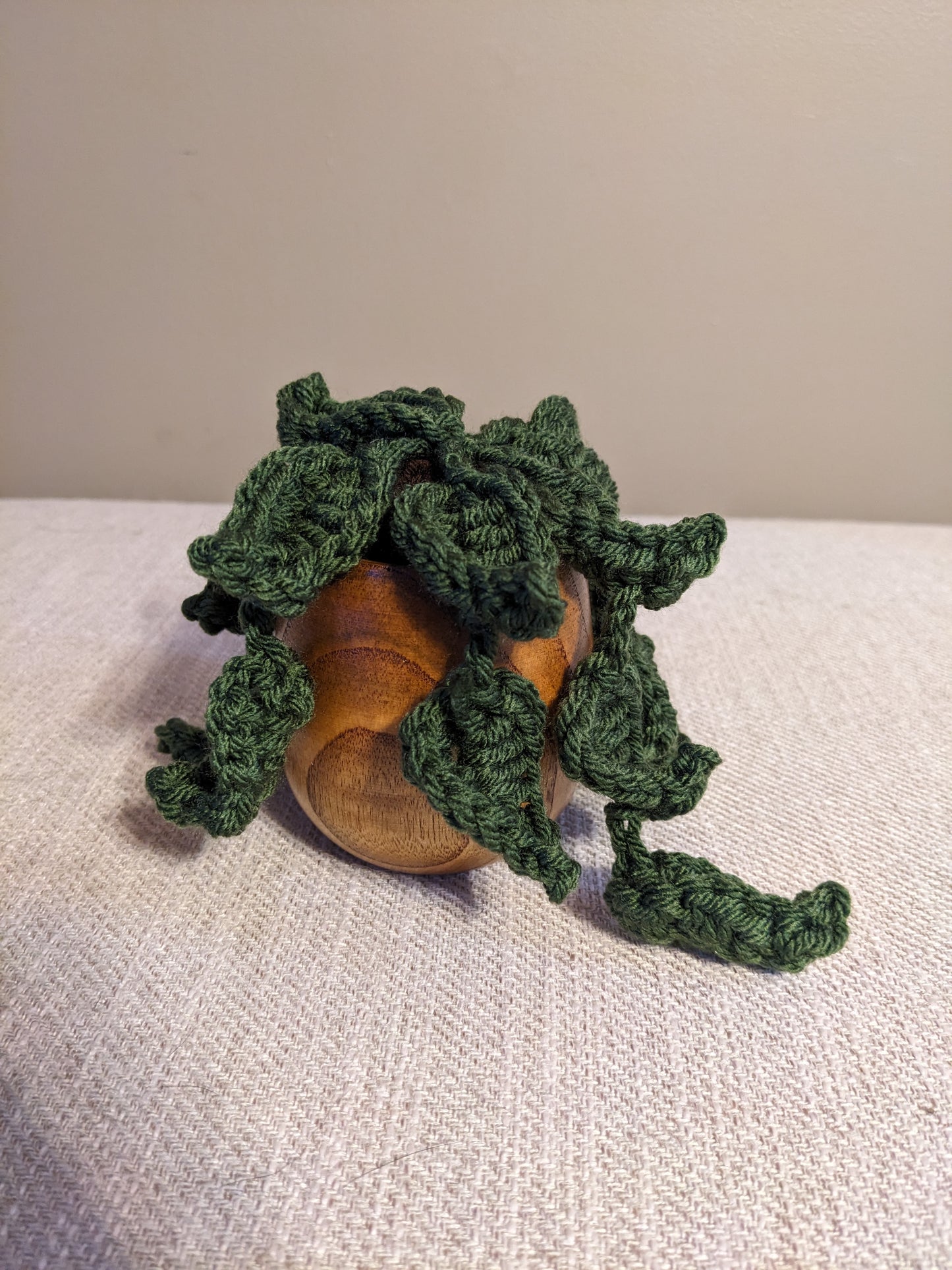 Crochet plant in wooden tea cup